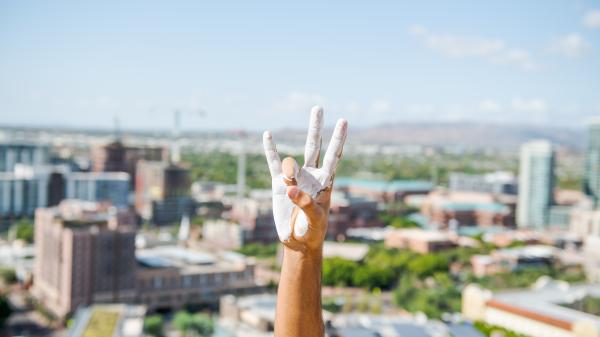 Pitchfork hand with Tempe background